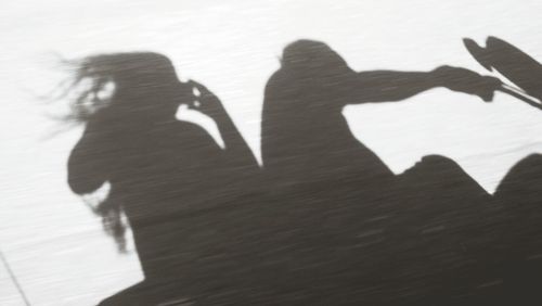 Shadow of couple on beach