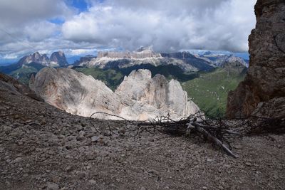 Scenic view of mountains against cloudy sky
