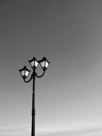 Low angle view of street light against sky