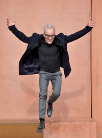 Portrait of happy man jumping