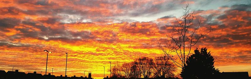 Low angle view of dramatic sky during sunset