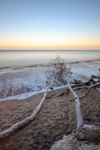 Scenic view of sea against sky at sunset