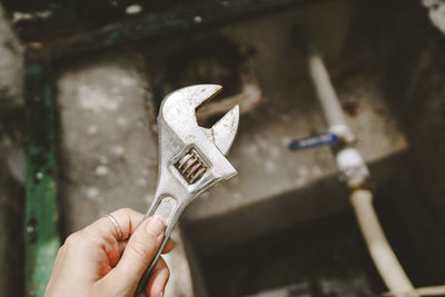 Cropped hand of person holding key