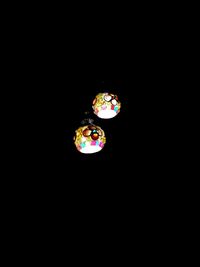 Low angle view of illuminated lighting in the dark