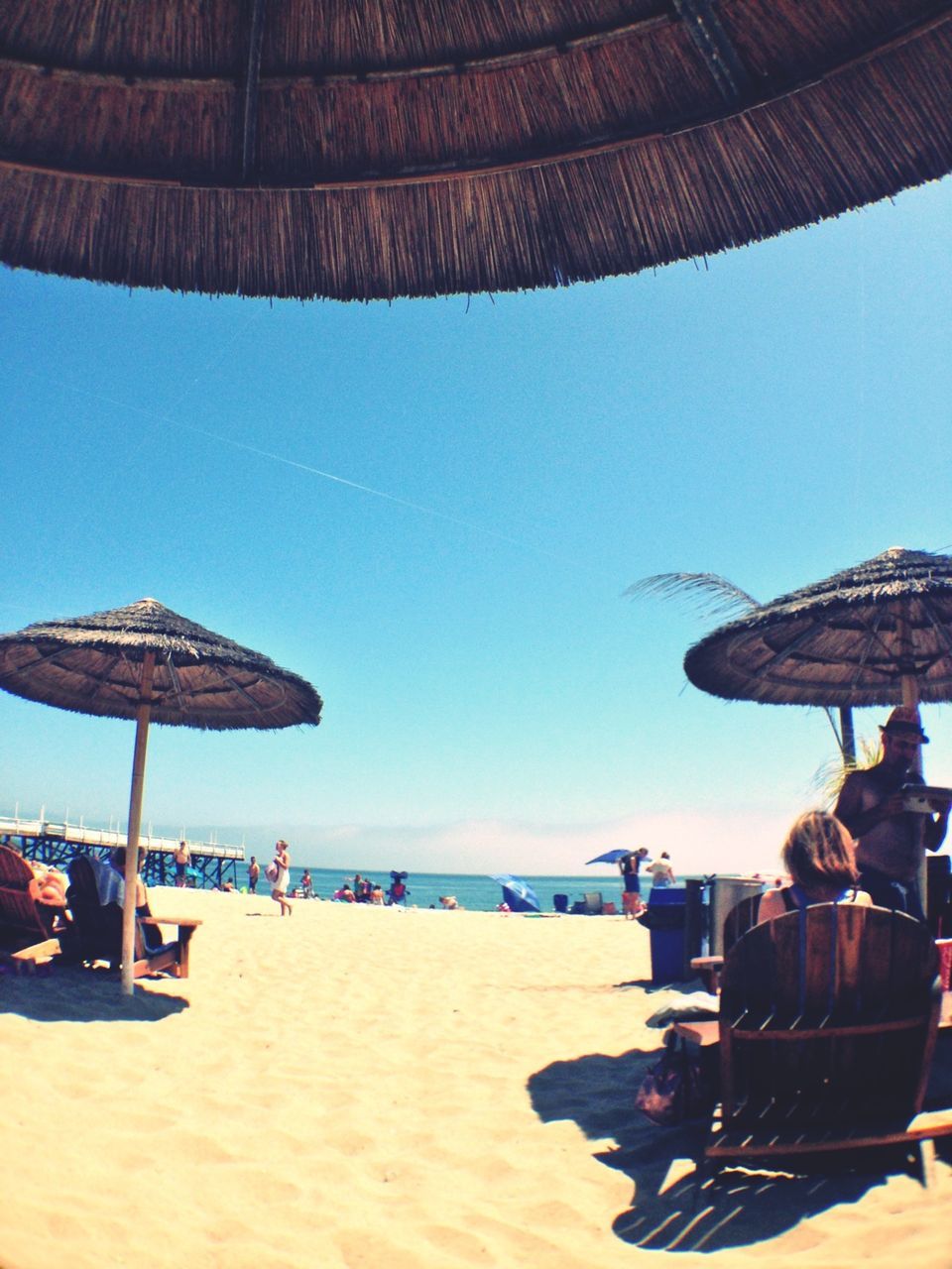 beach, sea, sand, beach umbrella, vacations, parasol, shore, water, leisure activity, sunshade, clear sky, large group of people, horizon over water, person, lifestyles, summer, men, tourism, enjoyment