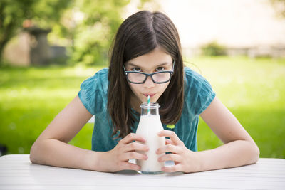 Portrait of a woman drinking water