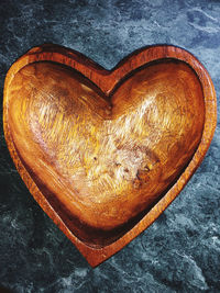 High angle view of heart shape on wood