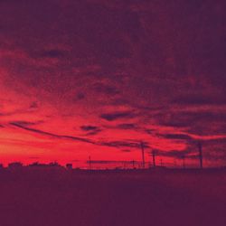 Silhouette landscape against sky during sunset