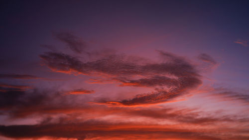 Low angle view of dramatic sky during sunset