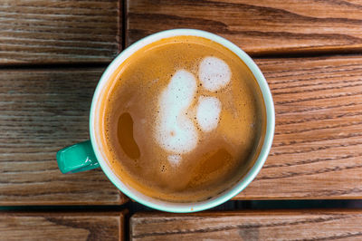 High angle view of coffee cup on table