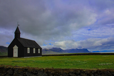 House on field against sky