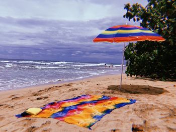 Multi colored umbrella on beach