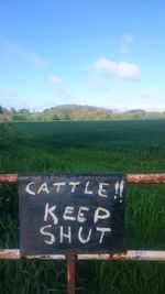 Information sign on grassy field