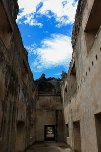 Low angle view of old buildings against sky