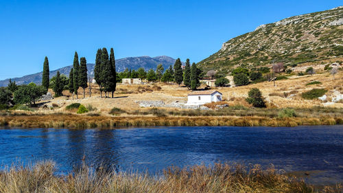 Scenic view of mountains against clear blue sky