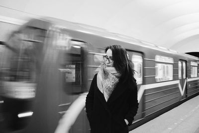 Blurred motion of man in train