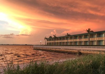 Scenic view of sea against orange sky