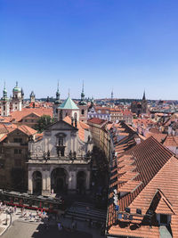 Buildings in city against clear sky