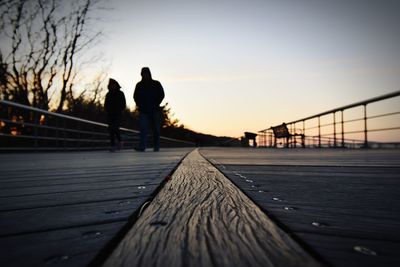 Sunset walk, relaxing board walking, couple walking,wood texture