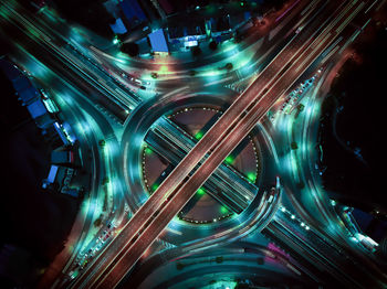 High angle view of light trails on highway at night