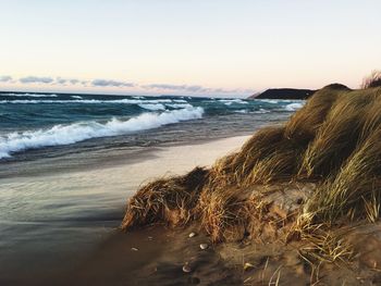 Scenic view of sea against sky at sunset