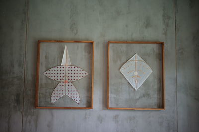 2 type of  kite with frame sticked on the wall