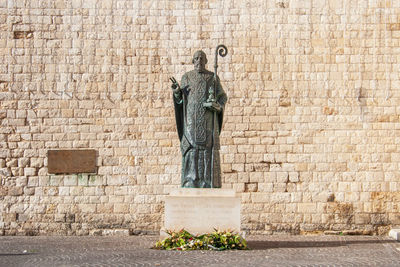 Statue against wall