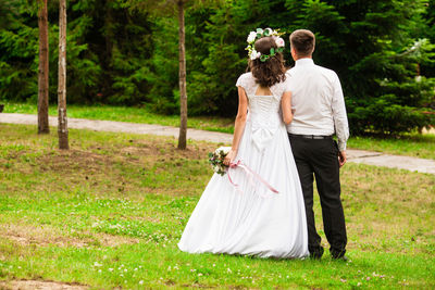 Rear view of couple kissing in park