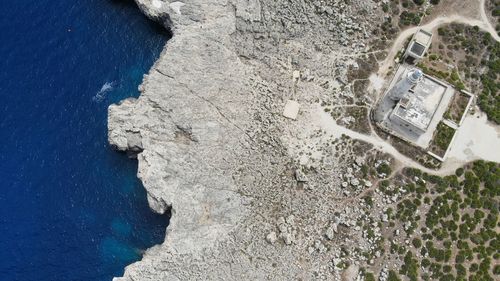 High angle view of rocks by sea