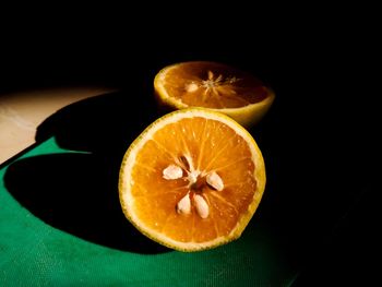 Close-up of orange slice on table