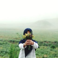 Full length of woman standing on field