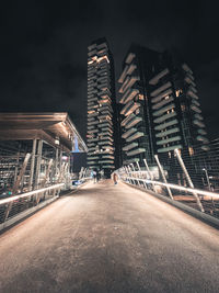 Illuminated buildings in city at night