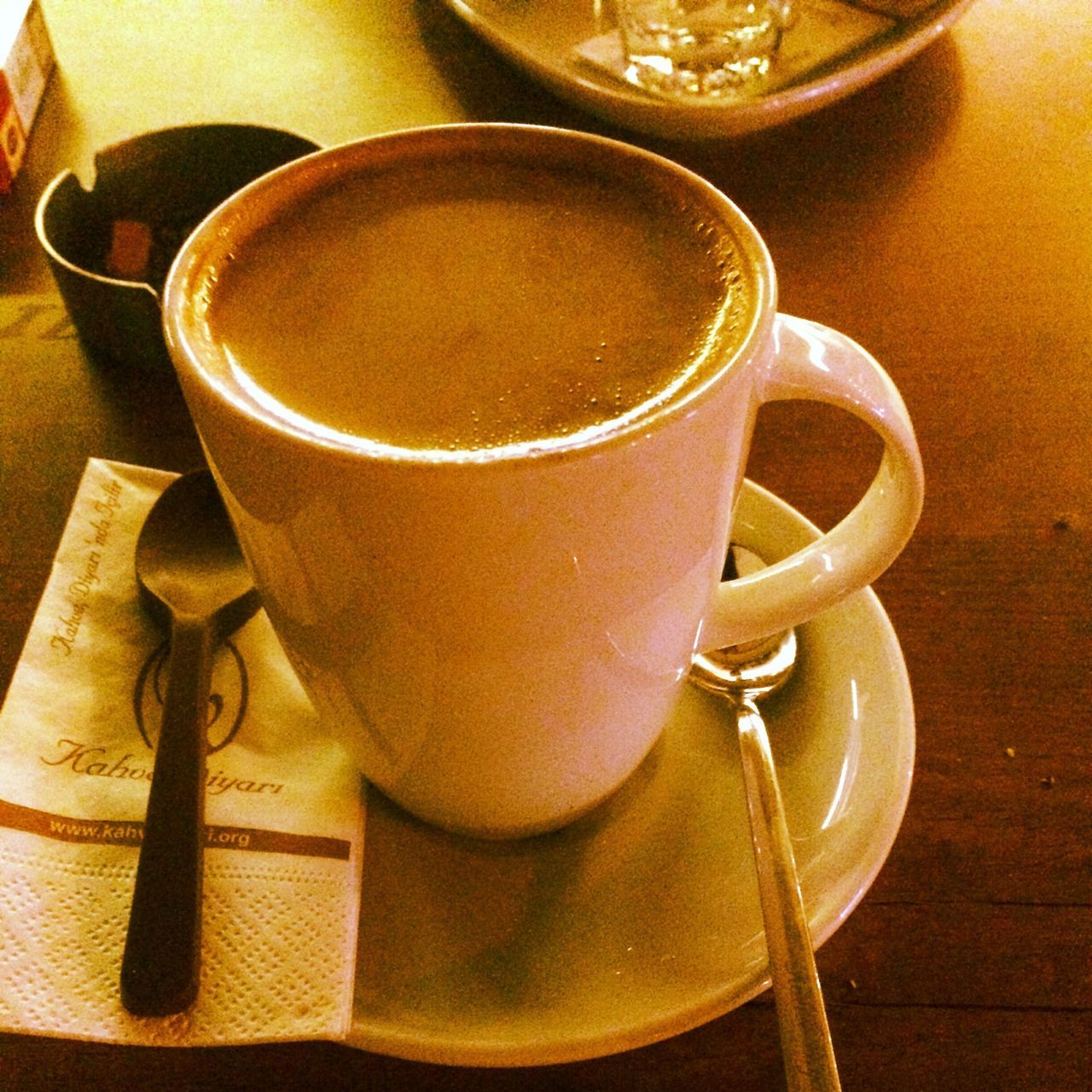 food and drink, indoors, table, drink, coffee cup, still life, refreshment, saucer, coffee - drink, freshness, coffee, cup, spoon, close-up, high angle view, no people, wood - material, healthy eating, tea cup, frothy drink