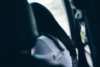 Close-up of man in car