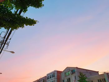 Low angle view of building against sky during sunset