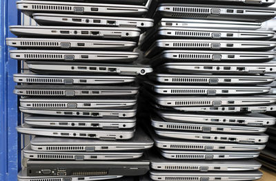 Big stacks of discarded laptops, notebooks on a trolley