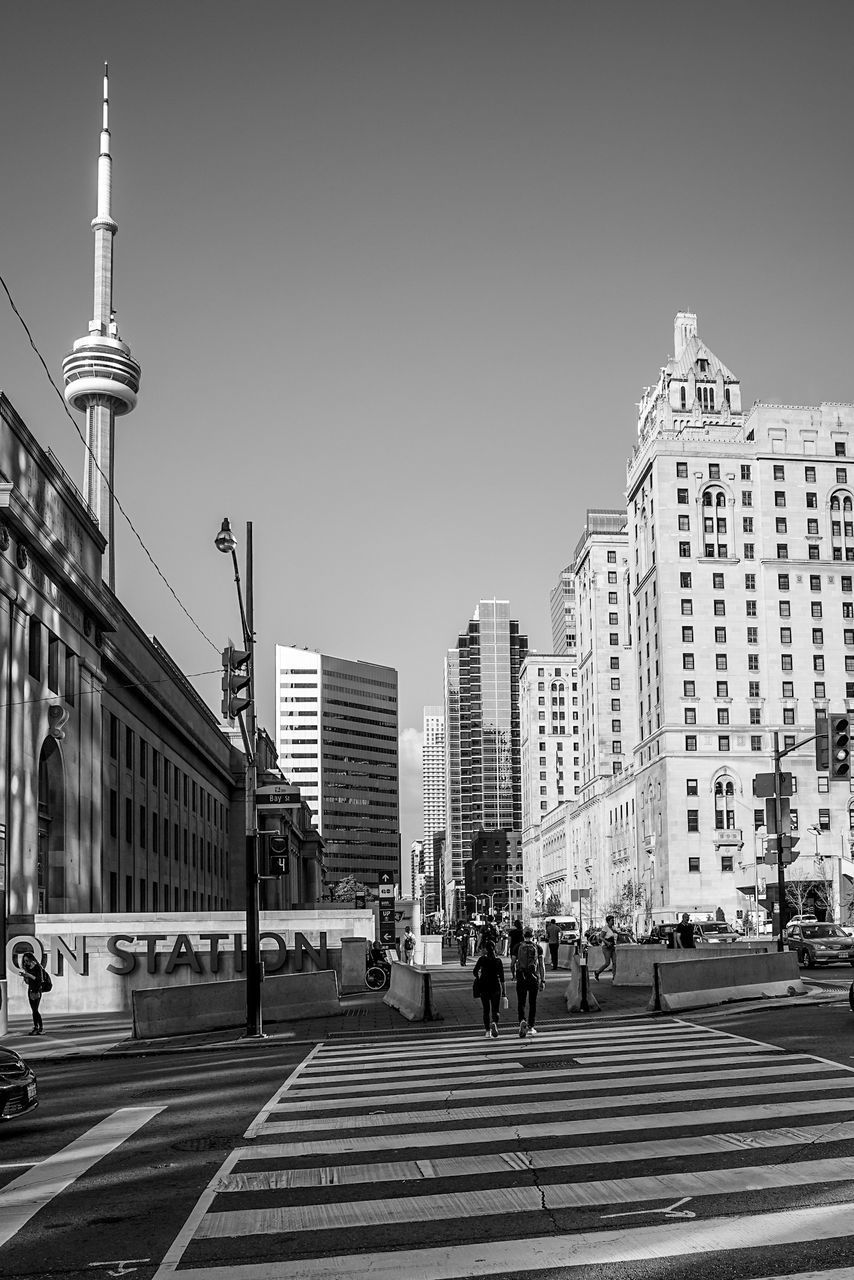 VIEW OF CITY STREET AGAINST CLEAR SKY