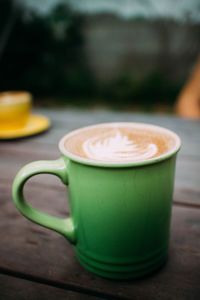 Close-up of coffee cup on table