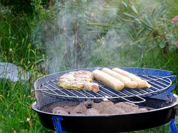 Close-up of meat on barbecue grill