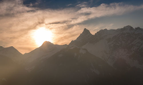 Scenic view of mountains against sky during sunset