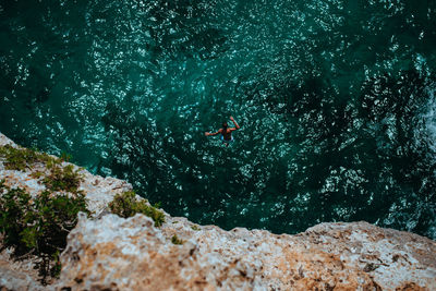 Man swimming in sea