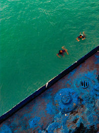 High angle view of people on boat in sea