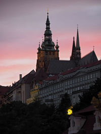 View of illuminated building against sky during sunset