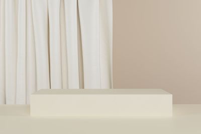 Close-up of white curtain on table