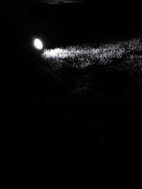 Illuminated field at night
