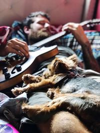 Close-up of friends lying on floor