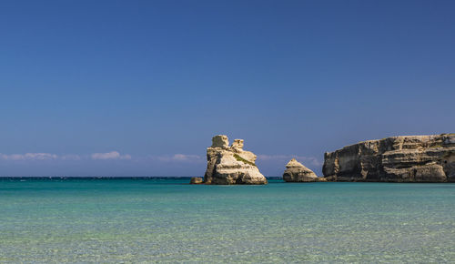 Scenic view of sea against clear blue sky