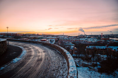 Illuminated city against sky during winter