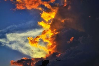 Low angle view of dramatic sky during sunset