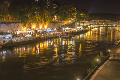 Reflection of illuminated buildings in water at night